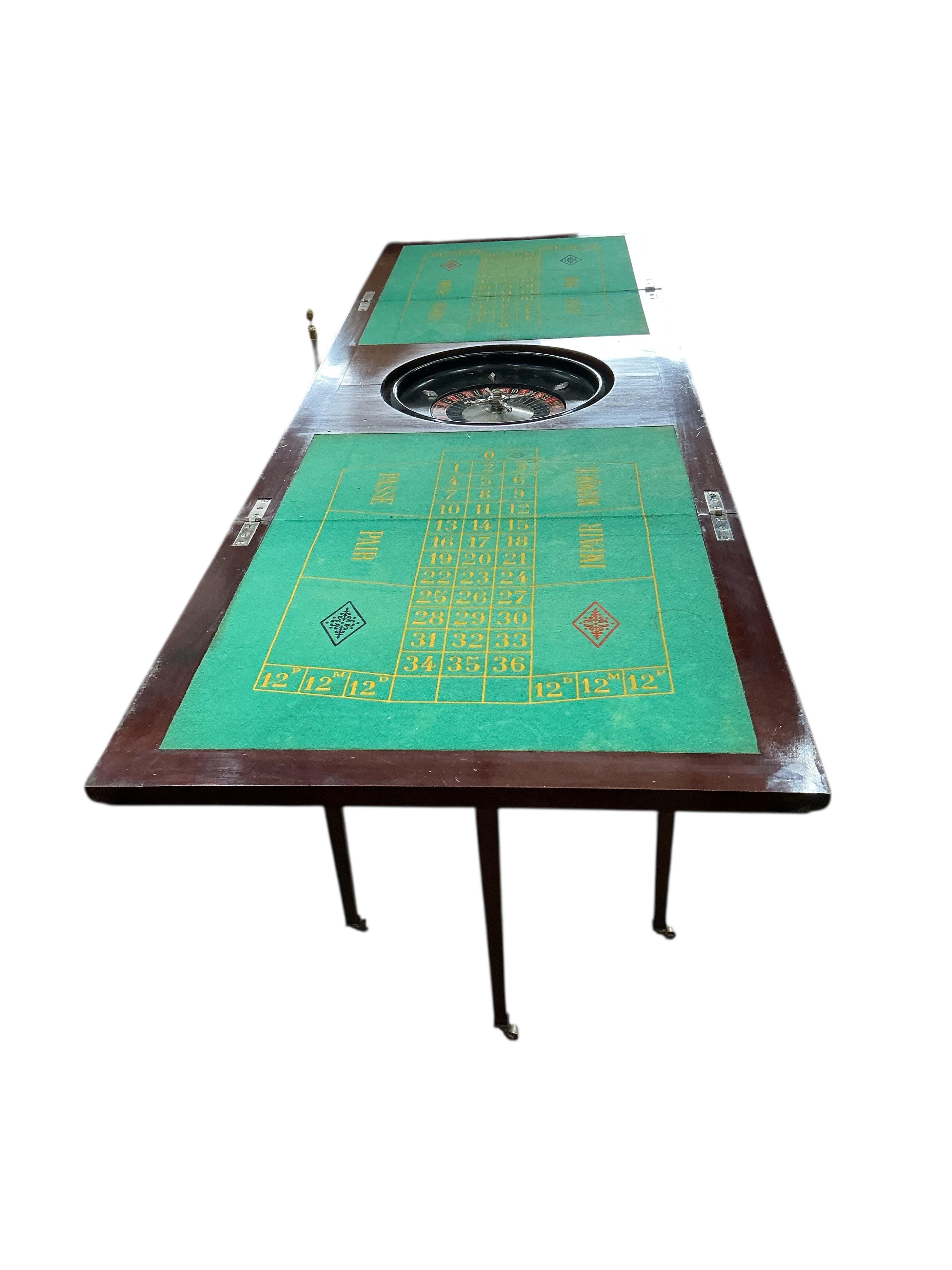 A rectangular mahogany roulette table with twin flap top, width 92cm, depth 57cm, height 77cm